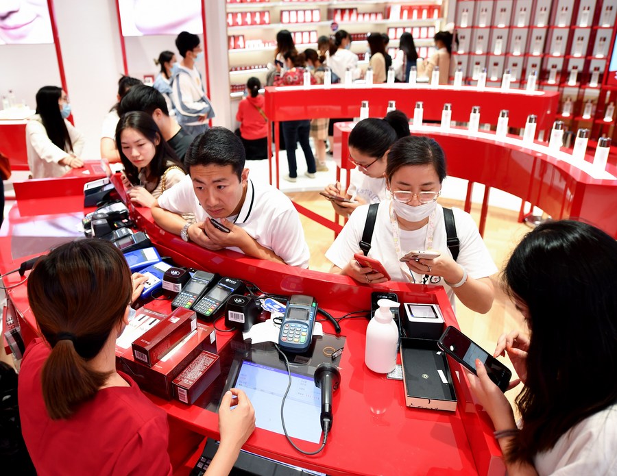 People shop at a duty-free store in Haikou, capital of south China's Hainan Province, Nov. 10, 2020. (Xinhua/Guo Cheng) CbsbeeE007040 20210210 CBMFN0A002