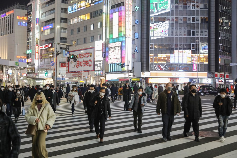 People wearing masks walk on the street in Tokyo, Japan, Jan. 22, 2021. (Xinhua/Du Xiaoyi) CbsbeeE007040 20210210 CBMFN0A003