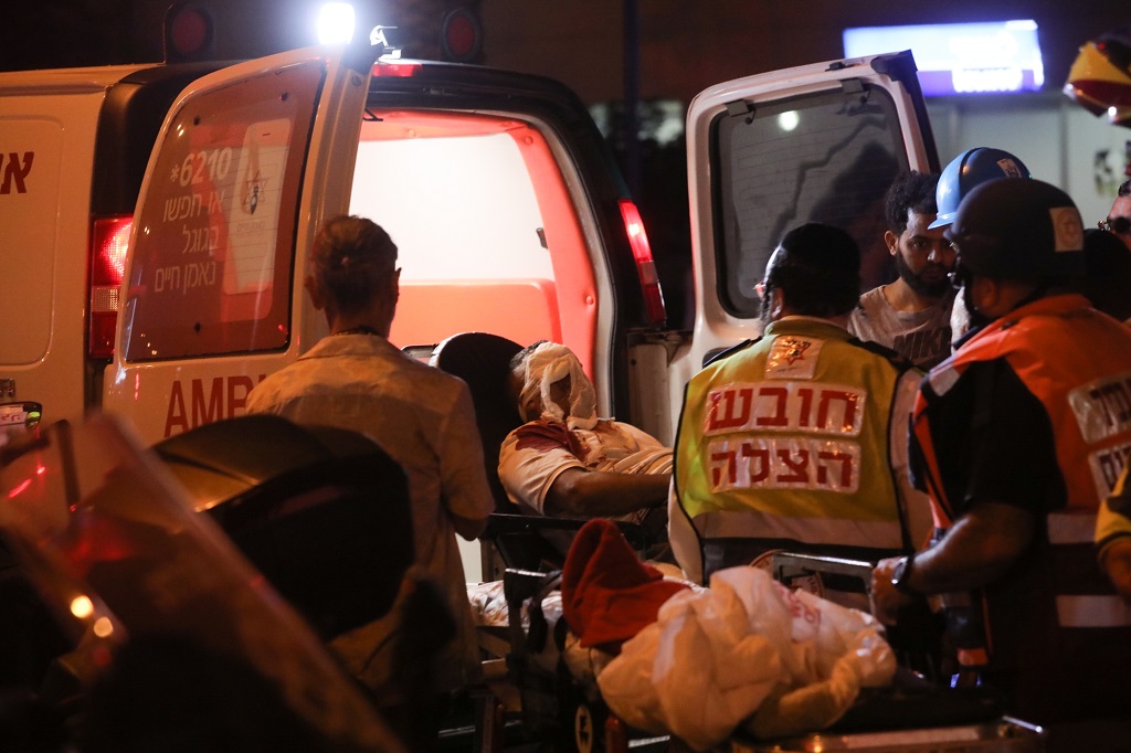 An Israeli man injured after a rocket from the Gaza strip landed is evacuated in central Israeli city of Holon, on May 11, 2021. (Nimrod Glikman/JINI via Xinhua) CcrbeeE007046 20210512 CBMFN0A002