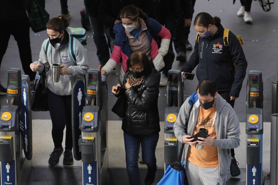 Commuters arrive in the morning rush hour at London Waterloo train station in London, Britain, on April 9, 2021. (Photo by Tim Ireland/Xinhua) XxjhmeE007030 20210513 CBMFN0A003