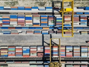 This aerial photo taken on May 11, 2023 shows a crane loading containers at a railway port in Horgos, northwest China's Xinjiang Uygur Autonomous Region. (Xinhua/Hao Zhao)