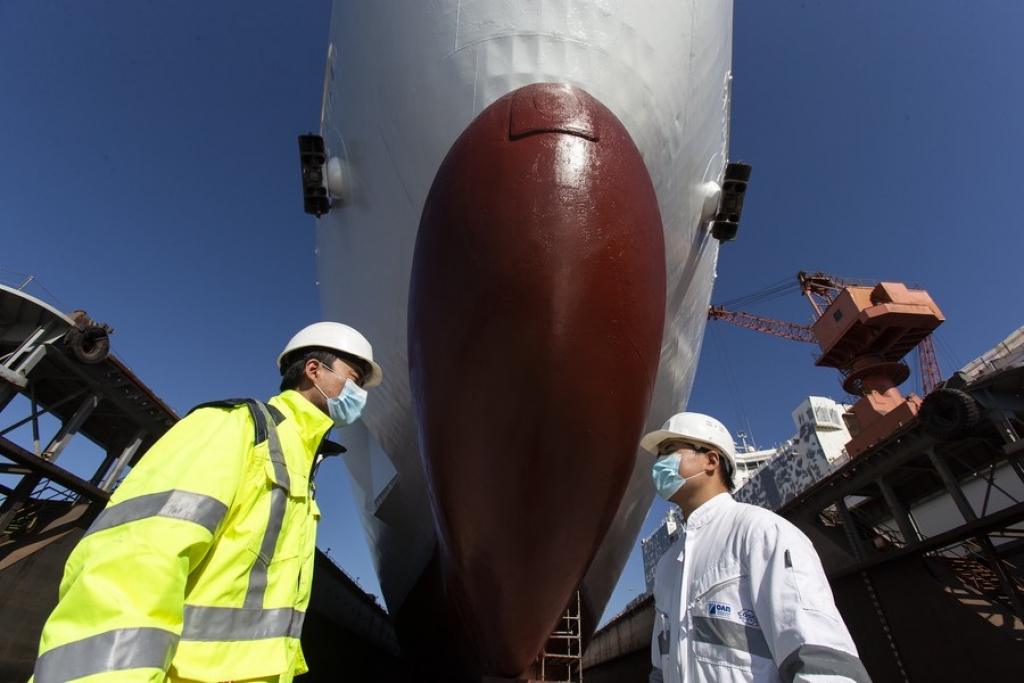 Chinese employees Ma Liang (R) and Zhang Baohua inspect the ship repair work at the Ship Repair Zone in the Piraeus port, Greece, Feb. 3, 2021. (Xinhua/Marios Lolos)