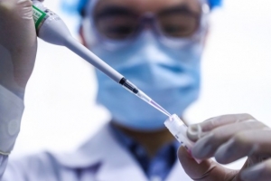 A staff member tests samples of the COVID-19 inactivated vaccine at a vaccine production base of Beijing Institute of Biological Products Co, Ltd. in Beijing, on April 11, 2020. The inactivated vaccine is developed by Sinopharm. (Xinhua/Zhang Yuwei)