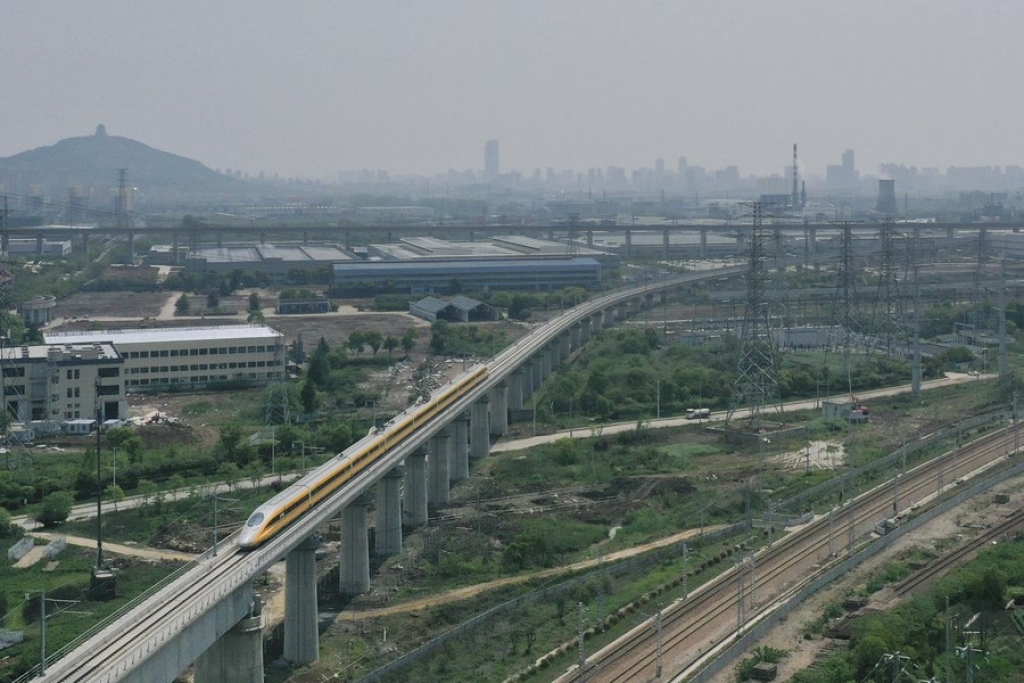 Aerial photo taken on April 22, 2020 shows a train running during its trial operation along the Shangqiu-Hefei-Hangzhou high-speed railway in Huzhou, east China's Zhejiang Province. (Xinhua/Huang Zongzhi)