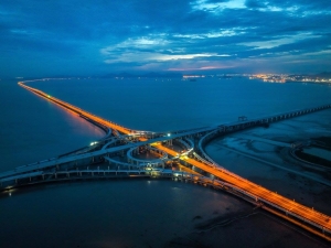 This aerial photo taken on June 30, 2023 shows the construction site of the Hangzhou-Ningbo expressway over the Jintang grand bridge in east China's Zhejiang Province. (Photo by Yao Feng/Xinhua)
