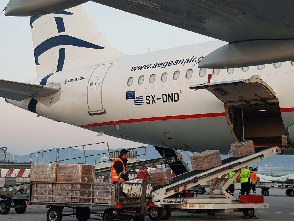 Aegean Airlines plane flies in 1.7 million surgical masks donated by Onassis Foundation, Greek shipowners
