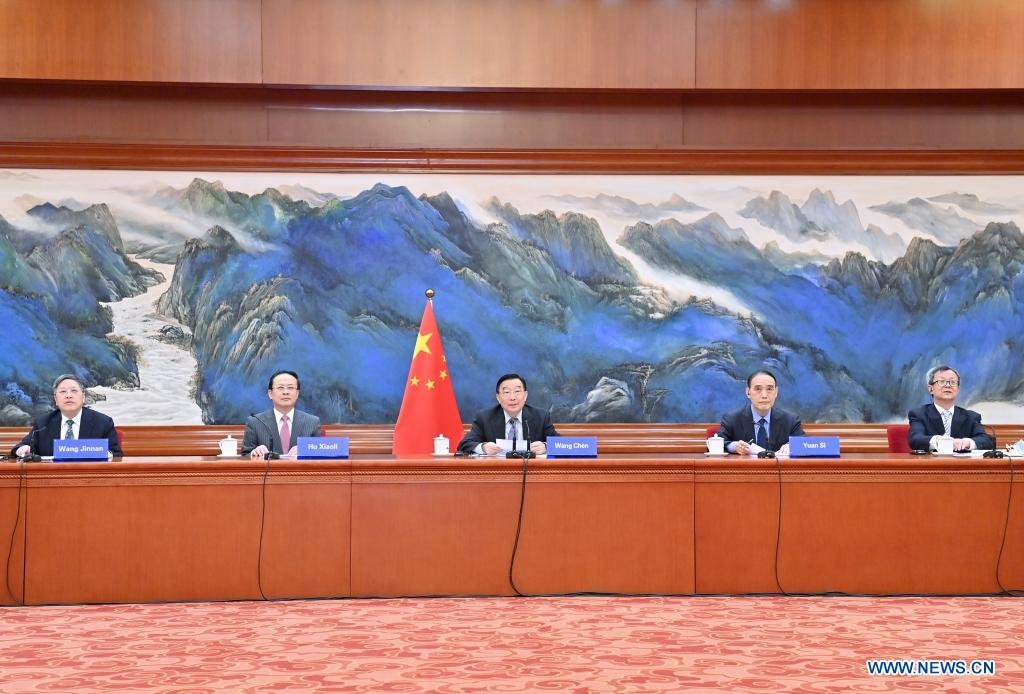 Wang Chen, a member of the Political Bureau of the Communist Party of China Central Committee and vice chairman of the National People's Congress (NPC) Standing Committee, delivers a speech while co-chairing a video conference between the NPC and the China-Bridge association with Hans-Peter Friedrich, vice president of the German Bundestag, in Beijing, capital of China, May 12, 2021. (Xinhua/Yue Yuewei)
