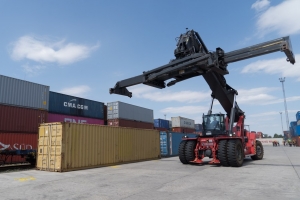 A worker prepares to unload cargo containers from the China-Europe freight train at the BILK logistics center in Budapest, Hungary, on April 27, 2020. (Photo by Attila Volgyi/Xinhua)