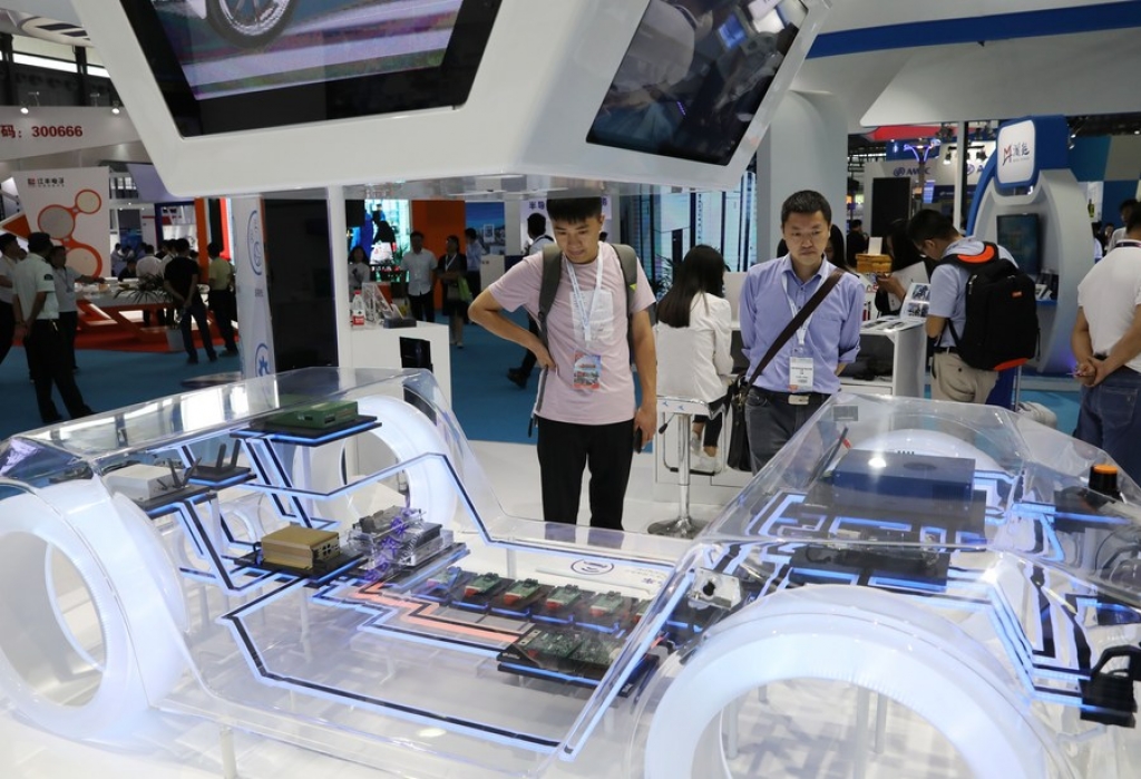 Visitors view integrated circuit for cars during the 17th China International Semiconductor Expo in Shanghai, east China, Sept. 3, 2019. (Xinhua/Fang Zhe)